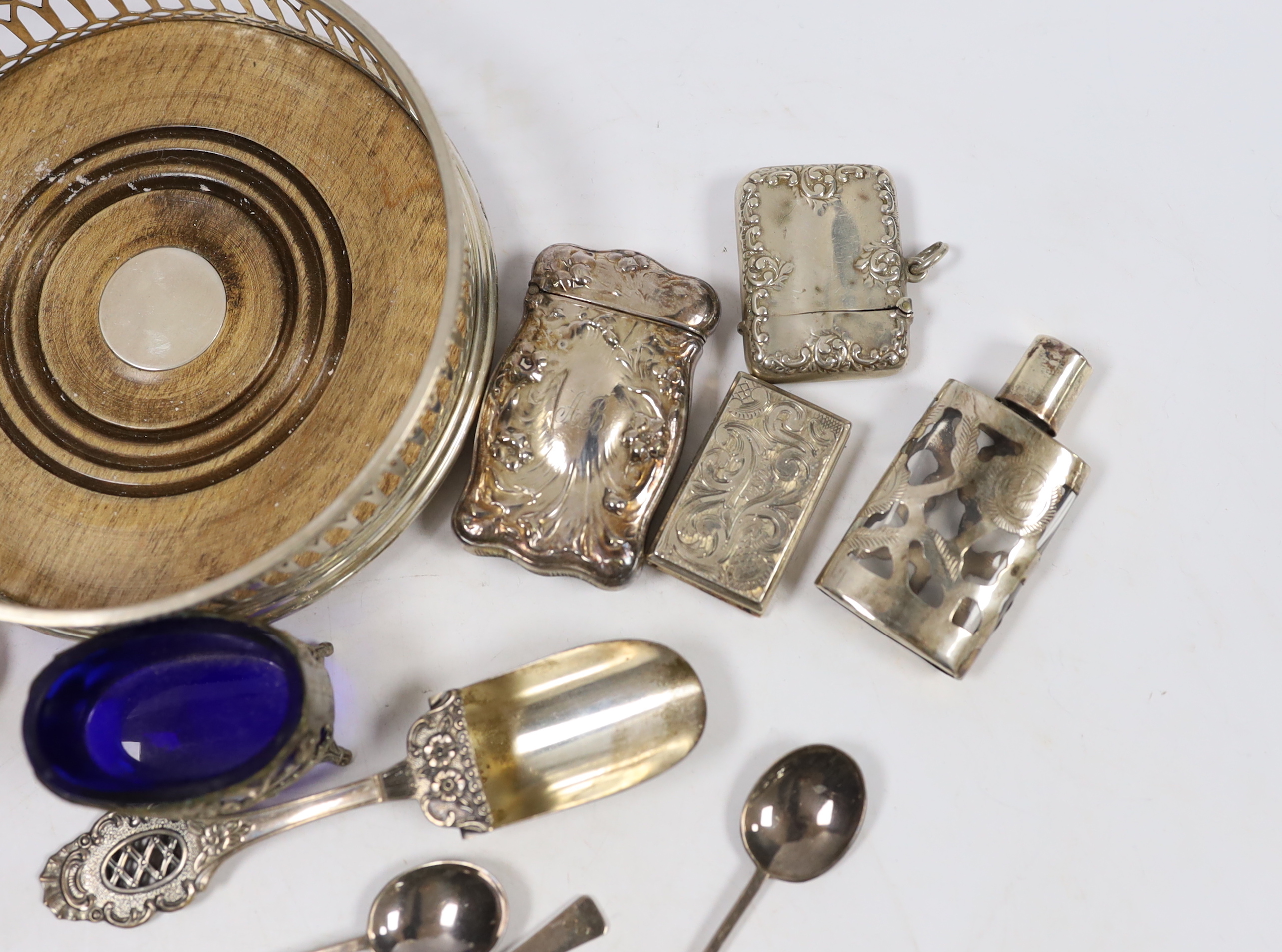 A modern silver mounted wine coaster, a silver compact, two vesta cases, an early Victorian silver vinaigrette, Taylor & Perry, Birmingham, 1839, 40mm, six silver coffee spoons and other sundry silver or white metal item